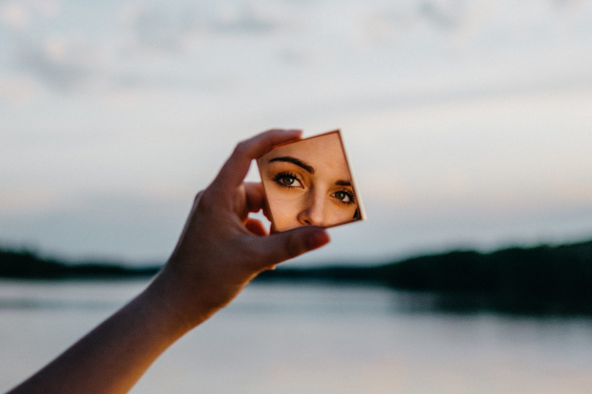 woman-holding-mirror-2460534